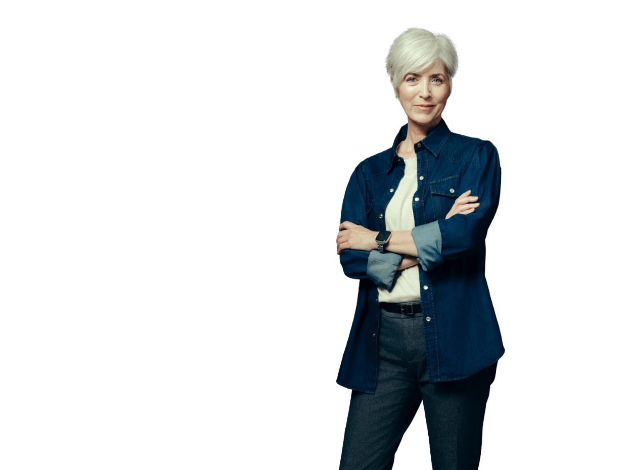 Middle-aged woman smiling at camera with her arms folded across her chest. Not actual patient