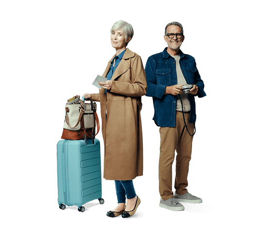 A middle aged woman and man standing with a suitcase. Not actual patients.