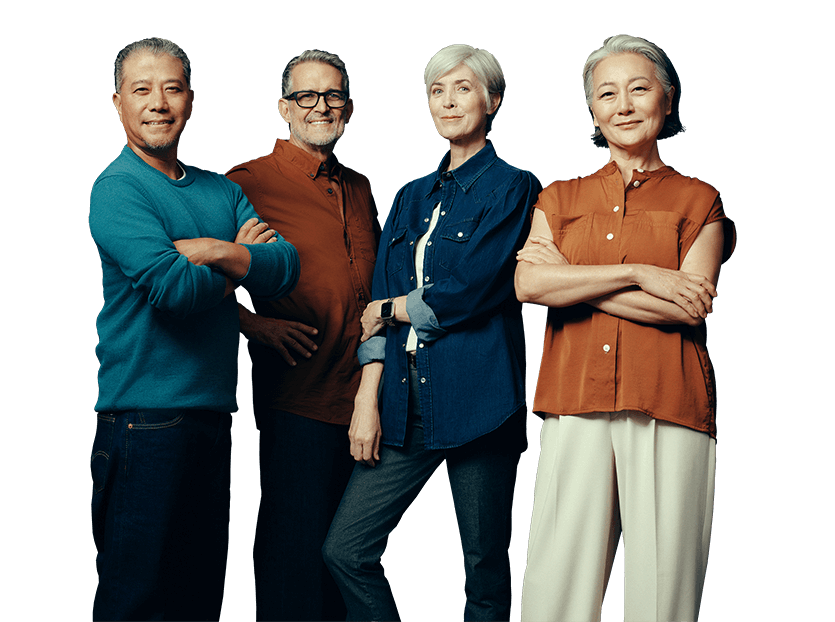 Four middle-aged people standing in different poses and smiling at the camera. Not actual patients.